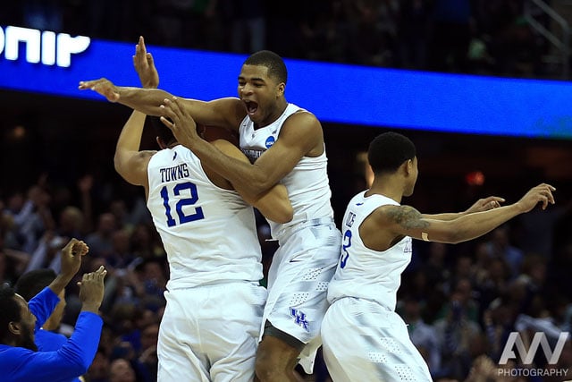 Kentucky Wildcats forward Karl-Anthony Towns (12) and guard Aaron Harrison (2) and guard Tyler Ulis (3) jump in the air after the game against the Notre Dame Fighting Irish in the finals of the midwest regional of the 2015 NCAA Tournament at Quicken Loans Arena. Kentucky won 68-66.