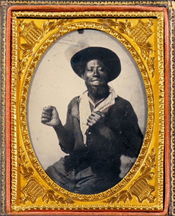 Ambrotype portrait of an African American man striking a boxing pose. Unknown, 1860. [#]