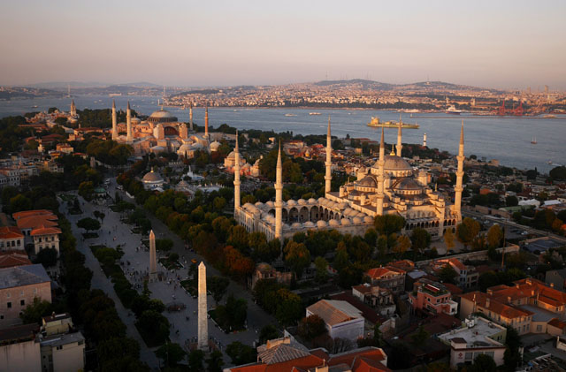 The spiky skyline of Istanbul as a freighter sails for the Sea of Marmara.