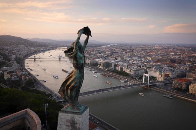The windswept Liberty Statue, overlooking Budapest. Built in 1947 by the new communist rulers for the “Liberating Soviet Heroes” the inscription was amended swiftly after  the USSR collapsed, "To the memory of all those who sacrificed their lives for the independence, freedom, and prosperity of Hungary"