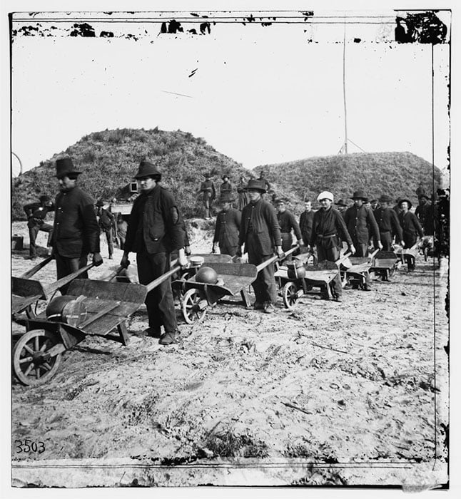 Union soldiers moving artillery shells with wheelbarrows in Fort McAllister, Georgia, by Samuel A. Cooley, 1864 [#]