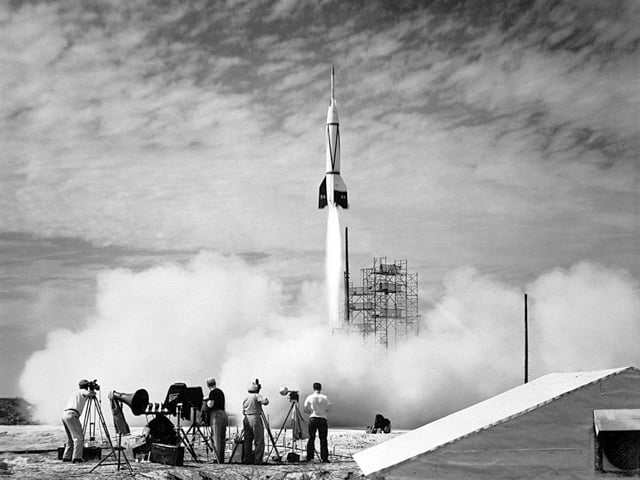 Photographers watching a rocket launch at Cape Canaveral