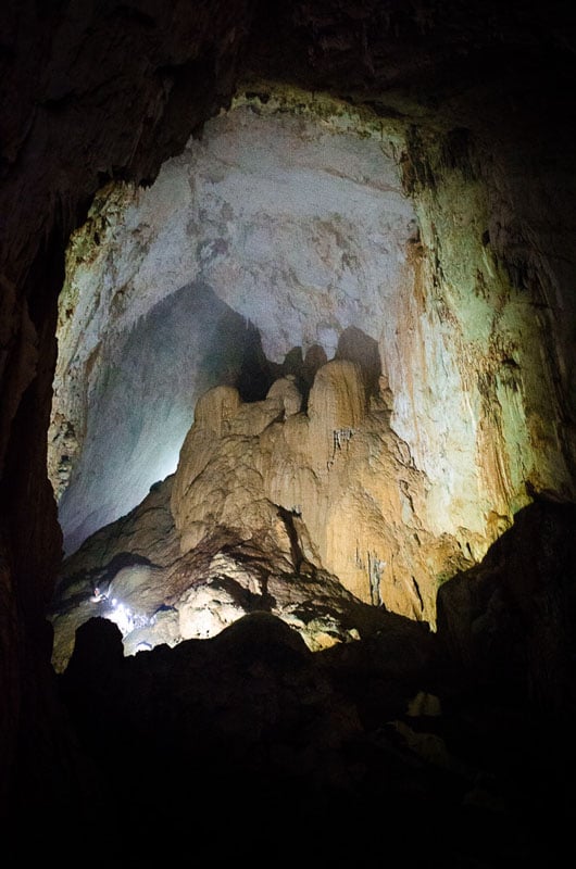 Notice the expedition team moving through the cave to the left. This passage is one of the smaller ones inside Son Doong, at just about 80 meters tall. Some chambers are over 200 meters tall. Photo by Sebastian Zethraeus