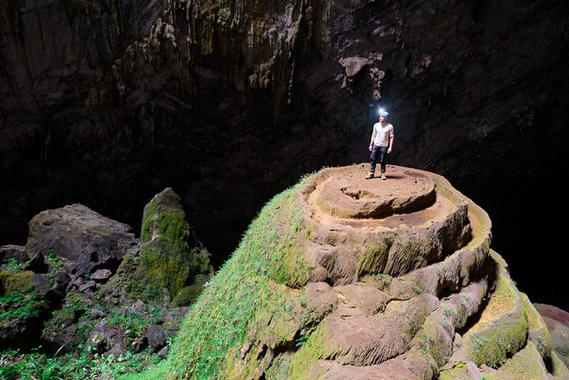 Martin Edström on top of a stalagmite inside the first doline o