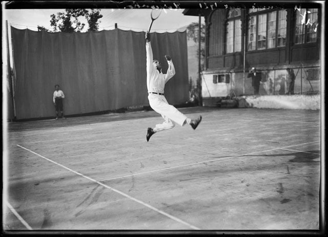 The tennis player M. Rodziunko tries to hit the ball by cutting a caper at the tennis tournament in Caux, canton of Vaud, Switzerland, in 1921. (KEYSTONE/ Photopress-Archive/ Jules Decrauzat) Glasplate