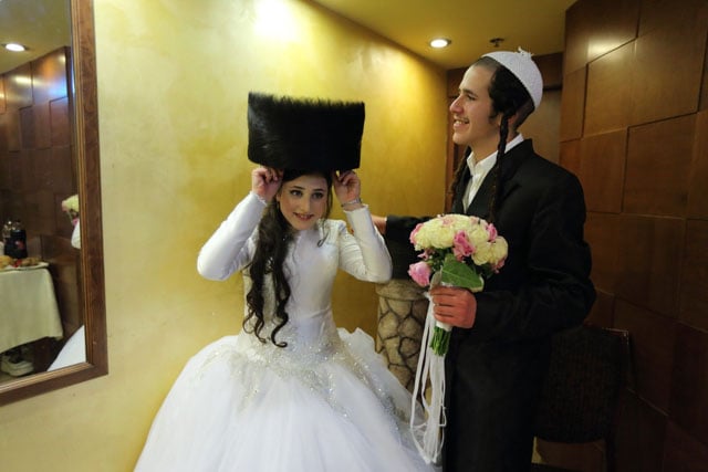 A young bride and groom. After leaving the wedding ceremony, the bride and groom enter a special room and closed called the unremarkable room, where they are alone for a few minutes.