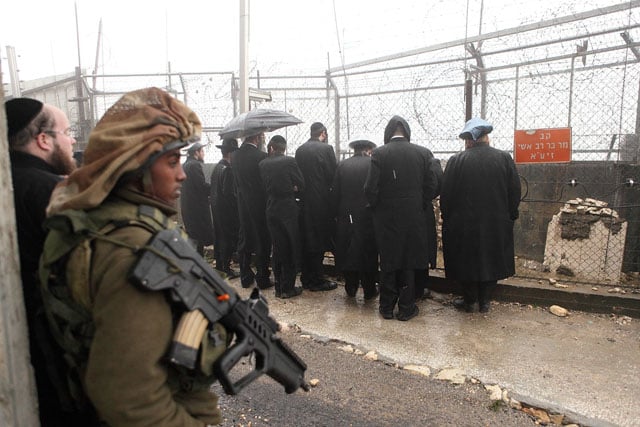 Ultra-Orthodox Jews pray at the grave of Rav Ashi. The grave is at the border of Israel and Lebanon.