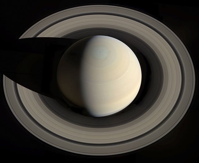 Saturn casting its shadow on its rings.