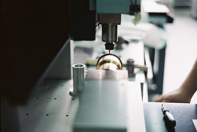 A Petzval lens undergoing engraving.