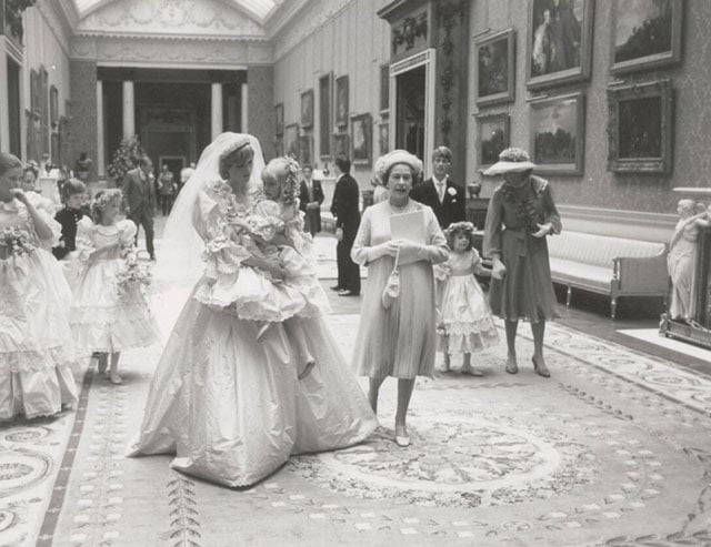 Princess Diana holding the five-year-old Clementine Hambro, her youngest bridesmaid.