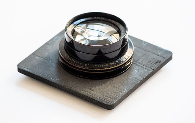 The 100+ year-old lens mounted on a few-days-old lens board. Photo: Ian Tuttle