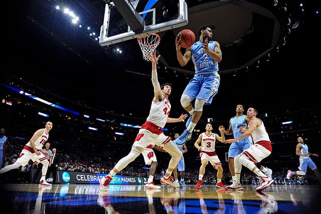 Mar 26, 2015; Los Angeles, CA, USA; North Carolina Tar Heels guard Joel Berry II (2) grabs a rebound against Wisconsin Badgers forward Frank Kaminsky (44) during the first half in the semifinals of the west regional of the 2015 NCAA Tournament at Staples Center. Robert Hanashiro/USA TODAY Sports