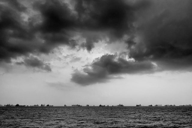 I used exposure compensation to really bring out the sky and silhouette these ships in the Singapore Straits before converting using my custom "apocalyptic monochrome" preset in Silver Efex Pro 2