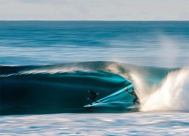 Bellet trailing a surfer in a barrel. Photo by Montgomery.