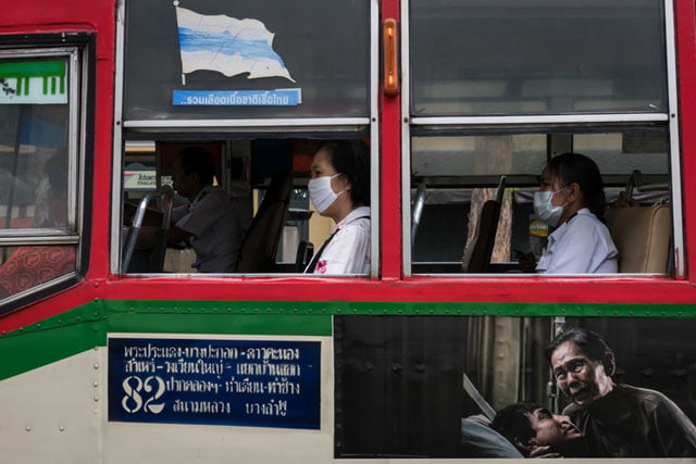 Another off-the-cuff shot but this caught my eye - the people wearing masks on the bus seemed to tie in with the sad "hospital" image on the side of the bus. Even the red marks on the left hand person's shirt reminded me of blood.
