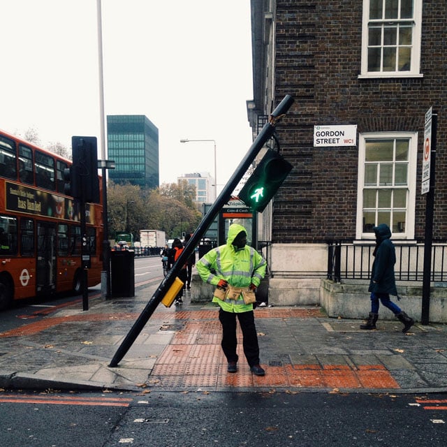 I saw the traffic light tilted and after crossing the road waited with my iphone for a few minutes to try and get a shot of someone waiting under it. To my delight the man in green turned up!