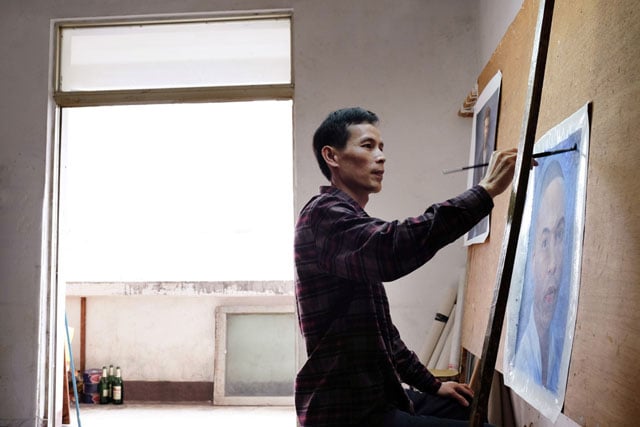 POC artist Thomas Linn works from a reference photo by David Hobby. He is shown painting the third of six layers of oil that will comprise the final version. (Photo by David Hobby)