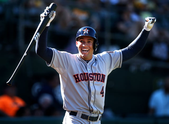 George Springer #4 of the Houston Astros celebrates after a teammate hits a home run during the game against the Oakland Athletics at O.co Coliseum on September 7, 2015 in Oakland, California. Photo by Brad Mangin.