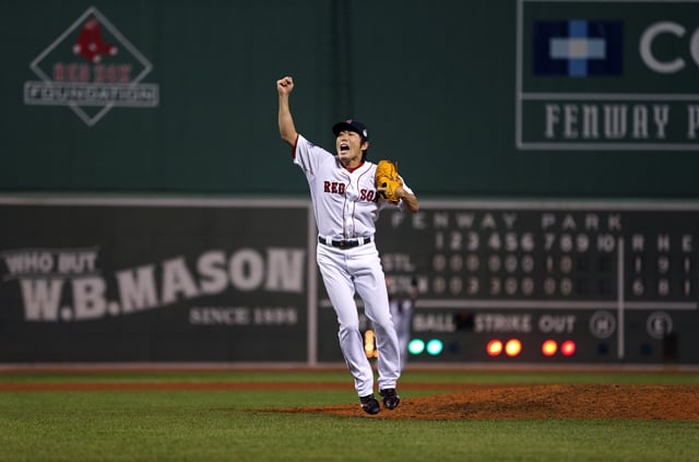 Koji Uehara and the Boston Red Sox win, 2013. Photo by Brad Mangin.