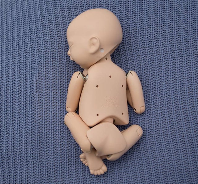 newborn photography posing doll