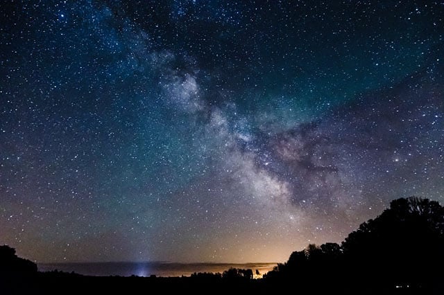 24mm, f/4, 21s, 6400ISO taken in a green zone. Less light pollution but it’s still visible. Caught some green airglow.