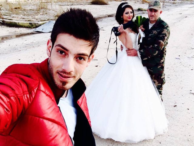 Photographer Jafar Meray with the bride and groom.