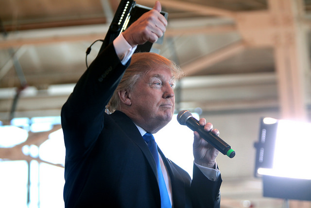 "Donald Trump speaking with supporters at a hangar at Mesa Gateway Airport in Mesa, Arizona."