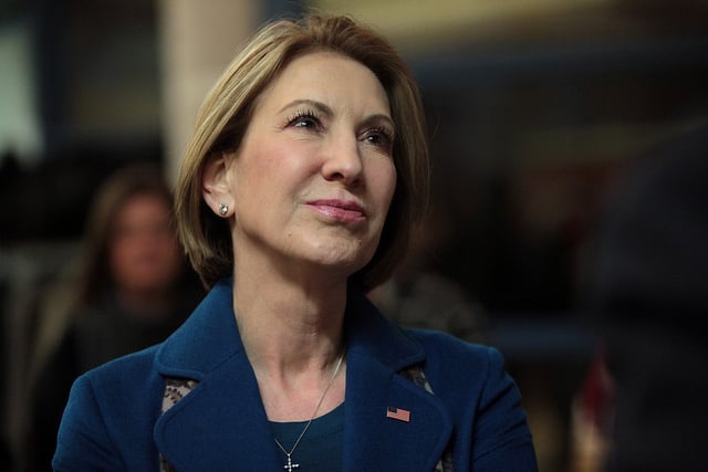 Carly Fiorina speaking with a attendees at a welcome back party marking the beginning of the new legislative session at the Iowa State Historical Building in Des Moines, Iowa.