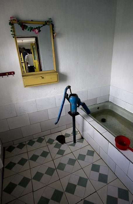 A photo of a rural house, where the bathroom was being used as a cistern.