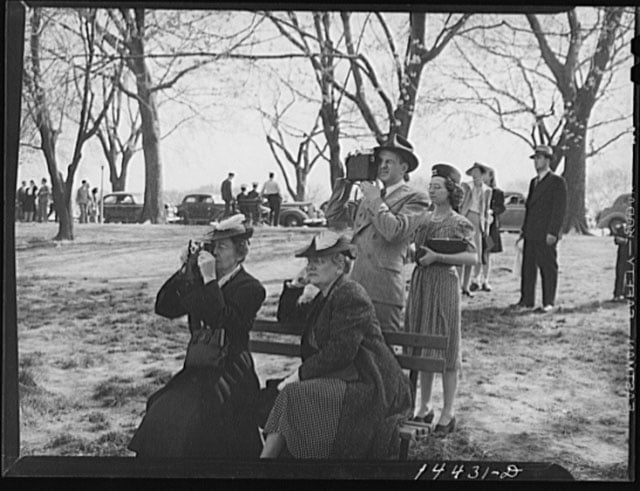 Camera bugs snapping the cherry blossoms across the Tidal Basin. Cherry Blossom Festival, Washington, D.C. Photo by Martha McMillan Roberts.