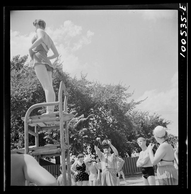 Washington, D.C. Publicity photographer and model at the municipal swimming pool on Sunday. Photo by Marjory Collins.