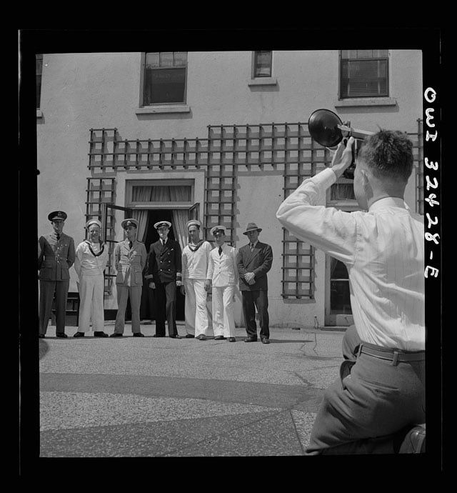 Oswego, New York. Heroes visiting during United Nations week lined up for a photograph by a local newspaper photographer. Photo by Marjory Collins.