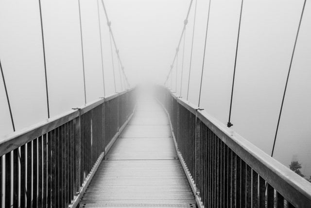 Bridge of Mystery Description: A foggy day on the Mile High Swinging Bridge of Grandfather Mountain, North Carolina.