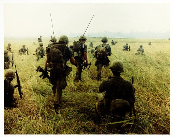 Chasin' Charlie, 1966. Members of the U.S. Army 101st Airborne Brigade prepare to move across a rice field near Tuy Hòa in pursuit of the enemy.Photo by Specialist 5 Robert C. Lafoon, U.S. Army.