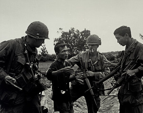 Interrogation, 1968. Elements of A Company, 5th Battalion, 7th Cavalry, U.S. Army 1st Air Cavalry Division interrogate a Viet Cong prisoner while on patrol in the Quế Sơn Valley during Operation Wheeler/Wallowa. Photo by Specialist 5 Richard A. “Dick” Durrance, U.S. Army.