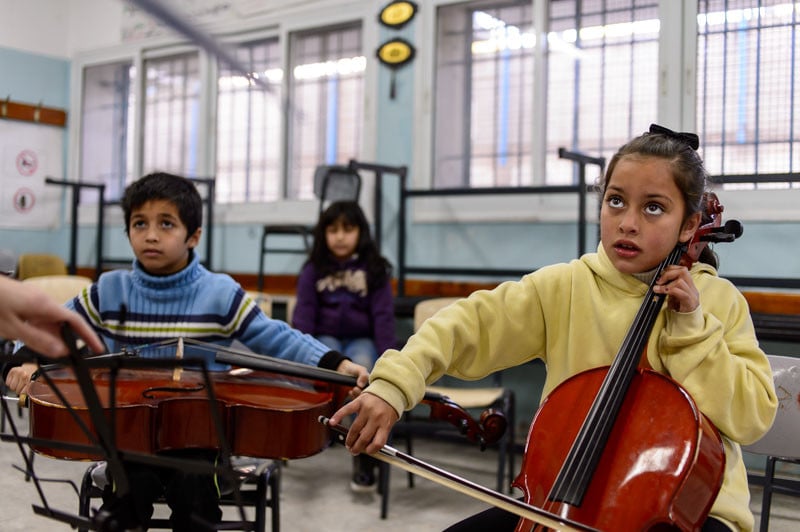 Mariah, 8 years old, Reem’s sister during a class of Musicians Without Borders.