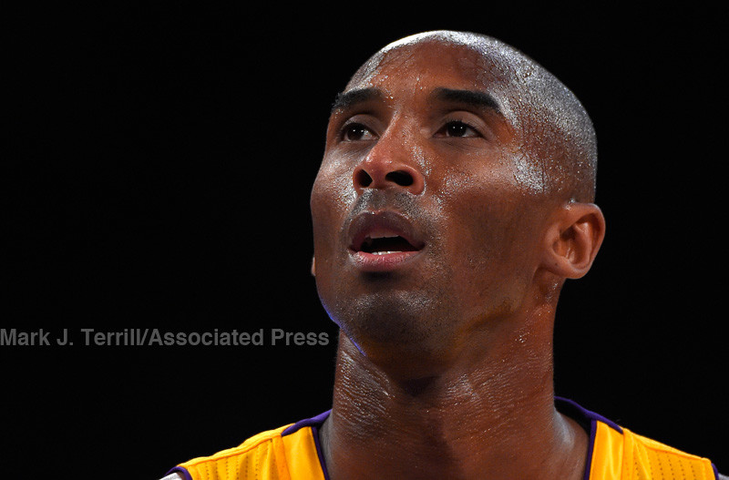 Los Angeles Lakers guard Kobe Bryant gets ready to shoot a free throw during the first half of a preseason basketball game against the Golden State Warriors, Thursday, Oct. 9, 2014, in Los Angeles.  (AP Photo/Mark J. Terrill)