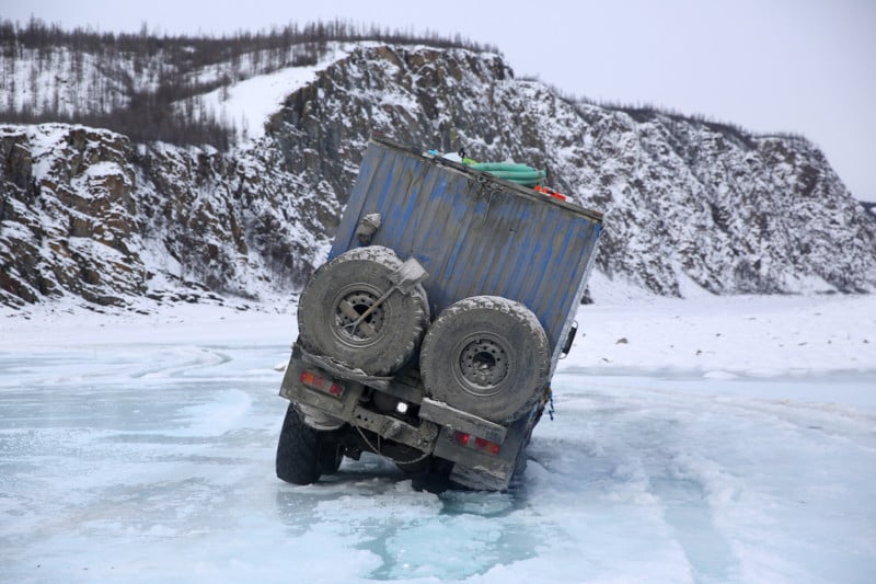 After seeing two places where trucks had recently plunged through the ice, we almost went through ourselves. After the chains were attached Ruslan managed to scrape back out of this situation and continue on.