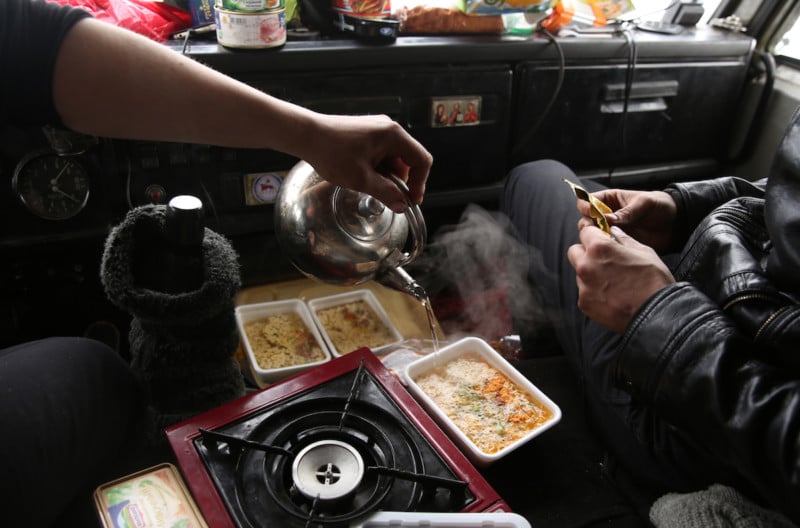 Even late in Spring, almost everything is done within the cab. This is lunch of instant noodles being served up by Ruslan.