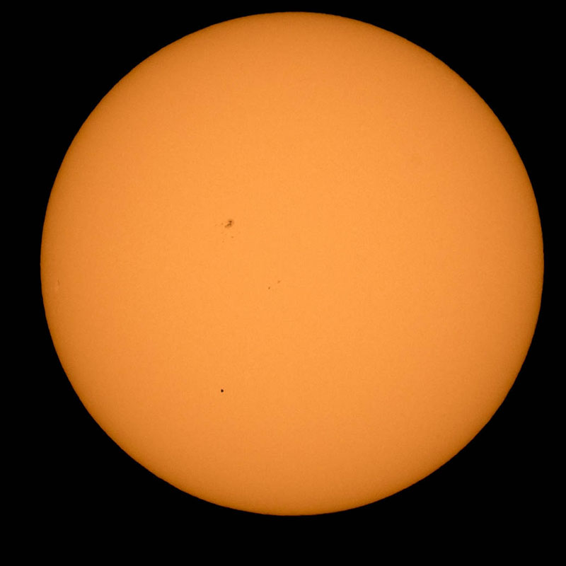 The planet Mercury is seen in silhouette, lower third of image, as it transits across the face of the sun Monday, May 9, 2016, as viewed from Boyertown, Pennsylvania.  Mercury passes between Earth and the sun only about 13 times a century, with the previous transit taking place in 2006.  Photo by NASA/Bill Ingalls.