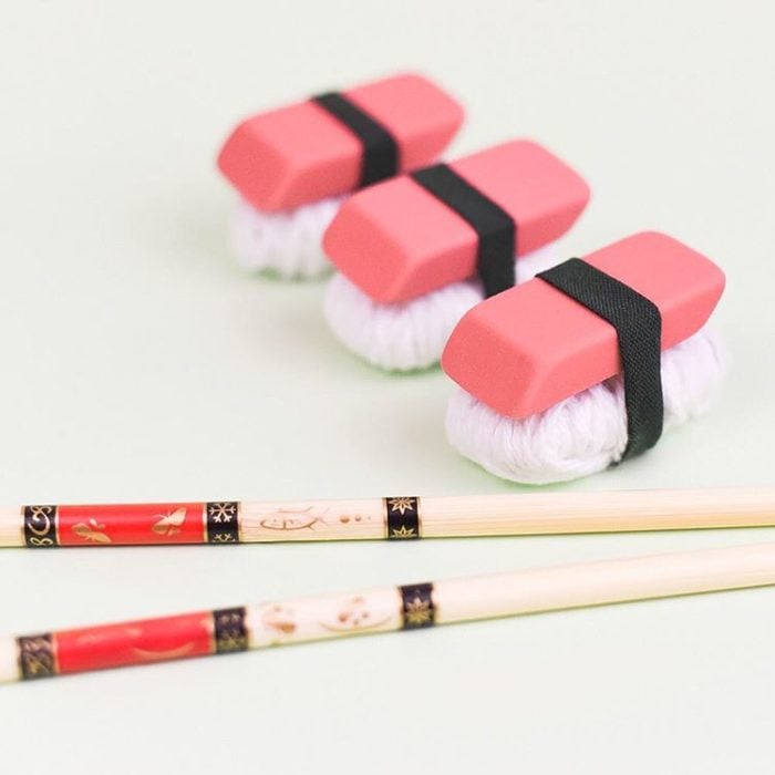 Erasers and yarn wrapped in athletic tape.