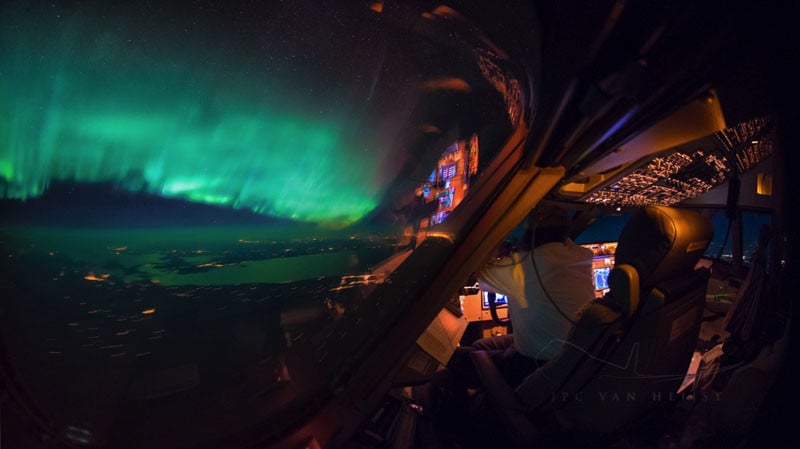 The Northern Lights from inside the cockpit of an airliner.