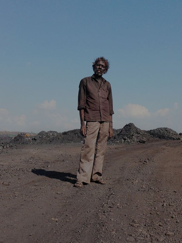 A contractual labour inside one of the coal mines in Jharia. He will make two dollars after loading almost five trucks with coal in Jharia.
