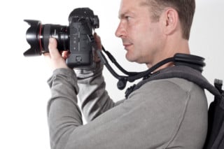 This Camera Strap Snaps to Backpack Straps to Relieve Neck Strain