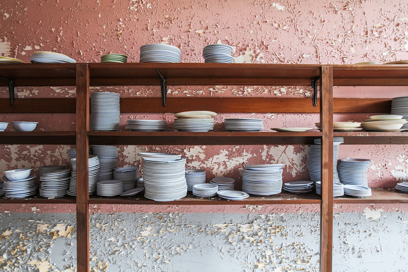 Patient dinnerware in a cafeteria storage area