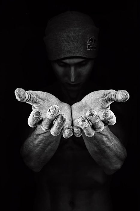 Denis Klero, Russia with his black and white shot of climber Rustam Gelmanov showing his chalk-covered hands in Fontainebleu, France.