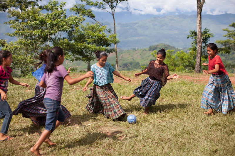 Q'eqchi girls playing football in Concepción Actelá, Alta Verapaz. Under Informed Consent rules, the parents of these children would have to be tracked down to give their consent for this photo to be taken or used. Photo by Sean Hawkey.