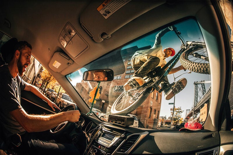 Ale Di Lullo, Italy for his fun shot of Aaron Chase riding his mountain bike on the windshield of a NYC cab.