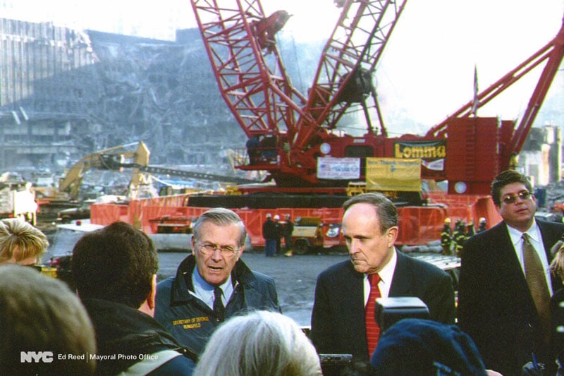 November 14, 2001. Mayor Rudy Giuliani and Secretary of Defense Donald Rumsfeld hold a press conference at Ground Zero two months after the 9/11 terrorist attacks.