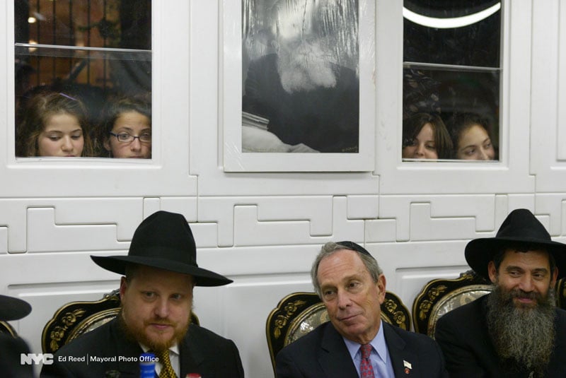 Sept. 20, 2005. The Mayor in Crown Heights in the sukkah of community council member Chanina Sperlin, (left) and Moshe Rubashkin.
